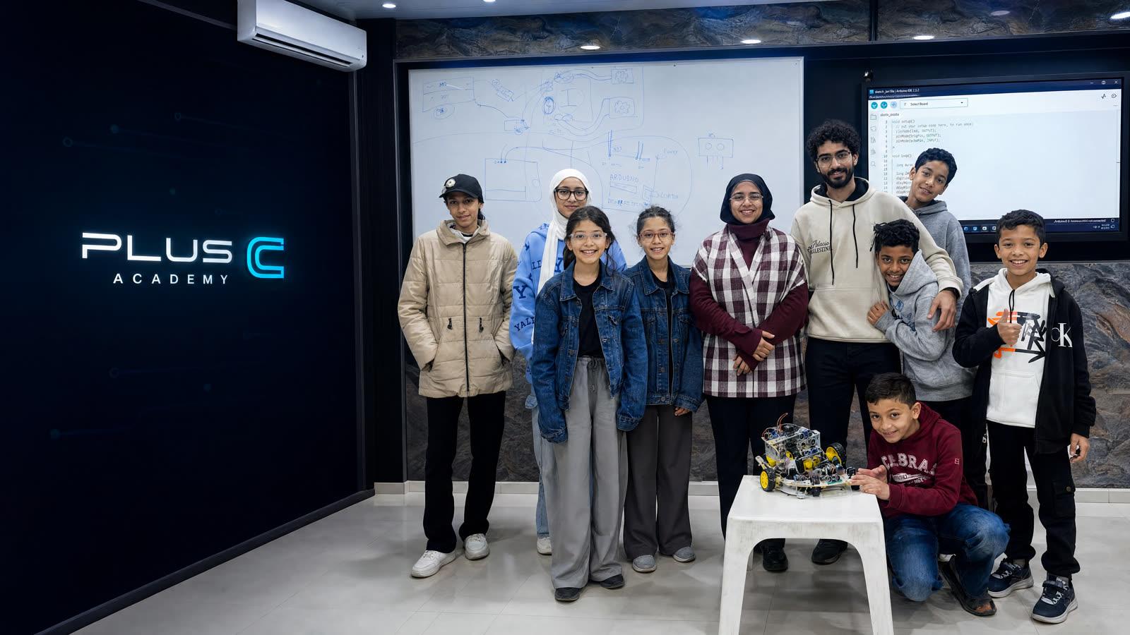 Plus C students and instructors in the previous cohort group photo